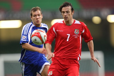 11.10.08 ... Wales v Liechtenstein, World Cup Qualifying Match Group 4, Millennium Stadium, Cardiff - Wales' Simon Davies is challenged by Liechtenstein's Franz Burgmeier   