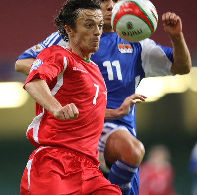 11.10.08 ... Wales v Liechtenstein, World Cup Qualifying Match Group 4, Millennium Stadium, Cardiff - Wales' Simon Davies is challenged by Liechtenstein's Franz Burgmeier   