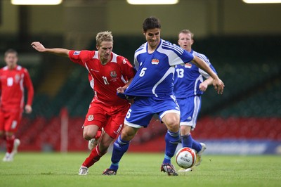 11.10.08 ... Wales v Liechtenstein, World Cup Qualifying Match Group 4, Millennium Stadium, Cardiff - Wales' David Edwards tangles with Liechtenstein's Martin Stocklasa  