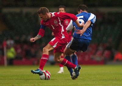 11.10.08 ... Wales v Liechtenstein, World Cup Qualifying Match Group 4, Millennium Stadium, Cardiff - Wales' Craig Bellamy  takes on Liechtenstein's Andreas Gerster  