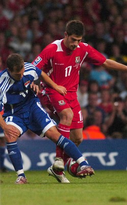 11.10.08 ... Wales v Liechtenstein, World Cup Qualifying Match Group 4, Millennium Stadium, Cardiff - Wales' Ched Evans  tangles with Liechtenstein's Franz Burgmeier  