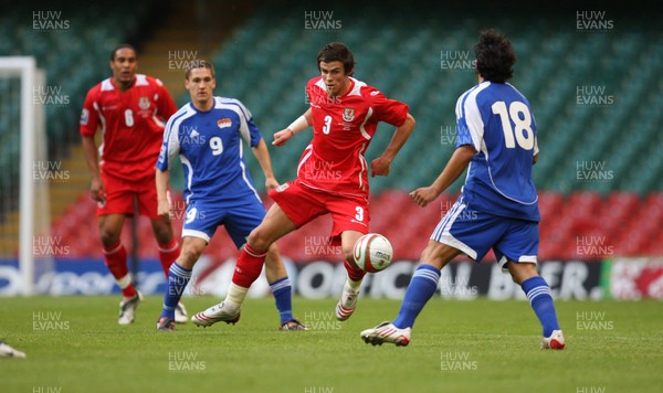 11.10.08 ... Wales v Liechtenstein, World Cup Qualifying Match Group 4, Millennium Stadium, Cardiff - Wales' Gareth Bale  takes on Liechtenstein's Michele Polverino  