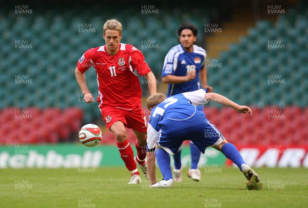11.10.08 ... Wales v Liechtenstein, World Cup Qualifying Match Group 4, Millennium Stadium, Cardiff - Wales' David Edwards takes on Liechtenstein's Martin Buchel  
