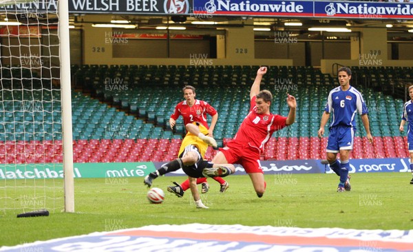11.10.08 ... Wales v Liechtenstein, World Cup Qualifying Match Group 4, Millennium Stadium, Cardiff - Wales' Sam Vokes challenges Liechtenstein's keeper Peter Jehle    