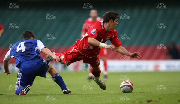 11.10.08 ... Wales v Liechtenstein, World Cup Qualifying Match Group 4, Millennium Stadium, Cardiff - Wales' Gareth Bale is brought down by Liechtenstein's Fabio D'Elia   