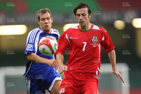 11.10.08 ... Wales v Liechtenstein, World Cup Qualifying Match Group 4, Millennium Stadium, Cardiff - Wales' Simon Davies is challenged by Liechtenstein's Franz Burgmeier   