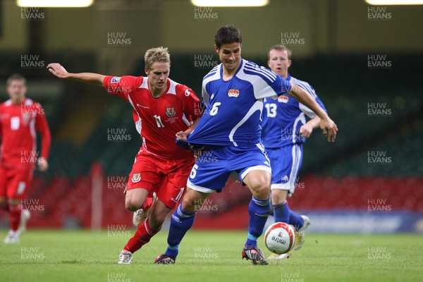 11.10.08 ... Wales v Liechtenstein, World Cup Qualifying Match Group 4, Millennium Stadium, Cardiff - Wales' David Edwards tangles with Liechtenstein's Martin Stocklasa  