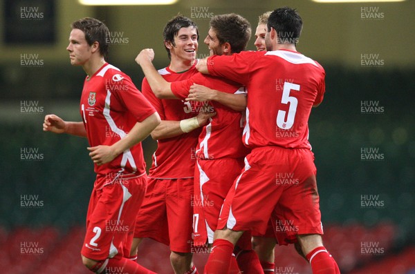 11.10.08 ... Wales v Liechtenstein, World Cup Qualifying Match Group 4, Millennium Stadium, Cardiff - Wales' Ched Evans is congratulated by teammates after he scores the second goal 
