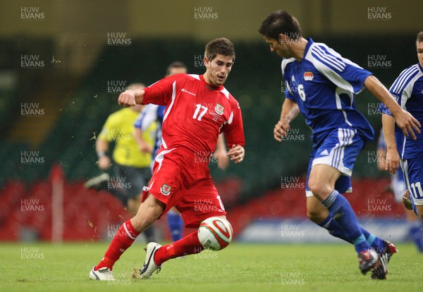 11.10.08 ... Wales v Liechtenstein, World Cup Qualifying Match Group 4, Millennium Stadium, Cardiff - Wales' Ched Evans takes on Liechtenstein's Martin Stocklasa  