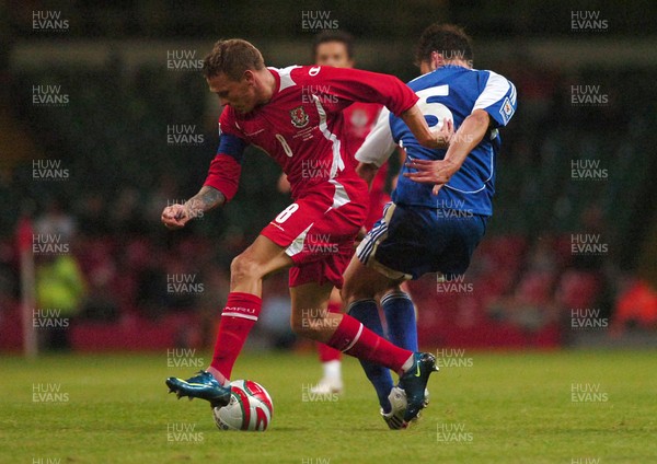 11.10.08 ... Wales v Liechtenstein, World Cup Qualifying Match Group 4, Millennium Stadium, Cardiff - Wales' Craig Bellamy  takes on Liechtenstein's Andreas Gerster  