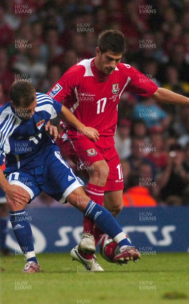 11.10.08 ... Wales v Liechtenstein, World Cup Qualifying Match Group 4, Millennium Stadium, Cardiff - Wales' Ched Evans  tangles with Liechtenstein's Franz Burgmeier  