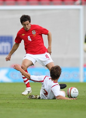 11.08.10 .. Wales v Luxembourg, .Friendly International, Llanelli -  Wales' Brian Stock is challenged by Luxembourg's Mathias Janisch  