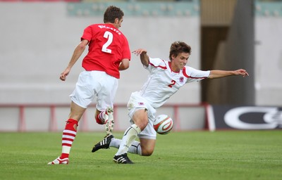 11.08.10 .. Wales v Luxembourg, .Friendly International, Llanelli -  Wales' Sam Ricketts and Luxembourg's Mathias Janisch compete for the ball 