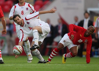 11.08.10 .. Wales v Luxembourg, .Friendly International, Llanelli -  Wales' Robert Earnshaw challenges Luxembourg's Eric Hoffmann for the ball 