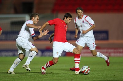 11.08.10 .. Wales v Luxembourg, .Friendly International, Llanelli -  Wales' Joe Ledley plays the ball forward 