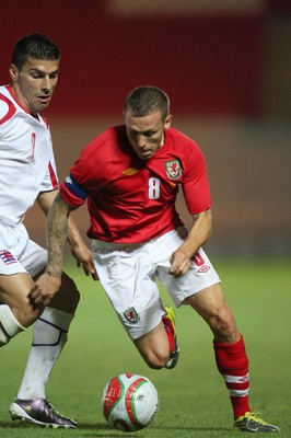 11.08.10 .. Wales v Luxembourg, .Friendly International, Llanelli -  Wales' Craig Bellemy takes on Luxembourg's Daniel Alves Da Mota   