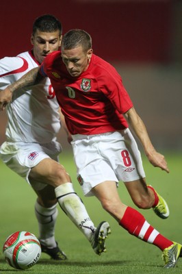 11.08.10 .. Wales v Luxembourg, .Friendly International, Llanelli -  Wales' Craig Bellemy takes on Luxembourg's Daniel Alves Da Mota   