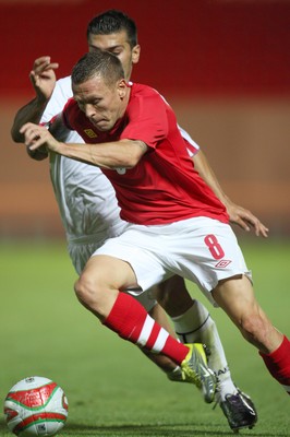 11.08.10 .. Wales v Luxembourg, .Friendly International, Llanelli -  Wales' Craig Bellemy takes on Luxembourg's Daniel Alves Da Mota   