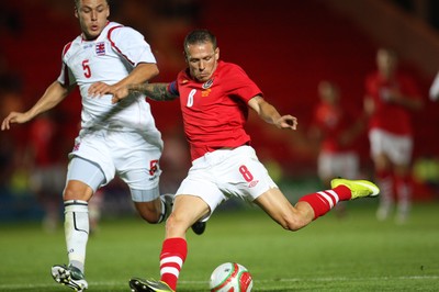 11.08.10 .. Wales v Luxembourg, .Friendly International, Llanelli -  Wales' Craig Bellemy shoots to score Wales' fifth goal 