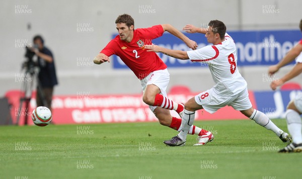 11.08.10 .. Wales v Luxembourg, .Friendly International, Llanelli -  Wales' Sam Ricketts takes on Luxembourg's Gilles Bettmer  