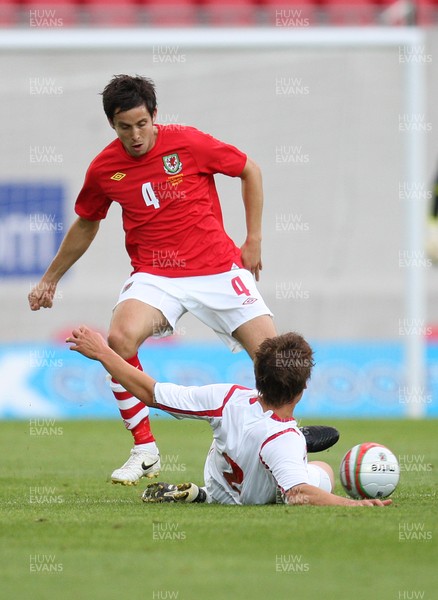 11.08.10 .. Wales v Luxembourg, .Friendly International, Llanelli -  Wales' Brian Stock is challenged by Luxembourg's Mathias Janisch  