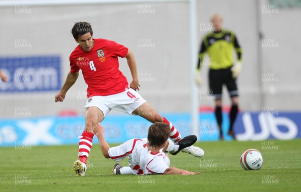 11.08.10 .. Wales v Luxembourg, .Friendly International, Llanelli -  Wales' Brian Stock is challenged by Luxembourg's Mathias Janisch  