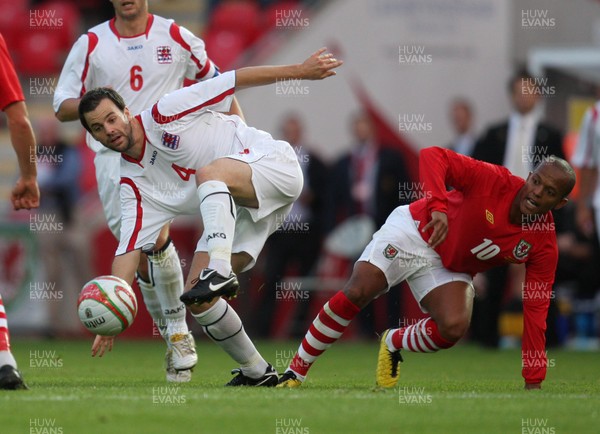 11.08.10 .. Wales v Luxembourg, .Friendly International, Llanelli -  Wales' Robert Earnshaw challenges Luxembourg's Eric Hoffmann for the ball 