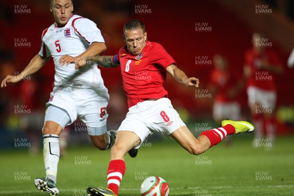 11.08.10 .. Wales v Luxembourg, .Friendly International, Llanelli -  Wales' Craig Bellemy shoots to score Wales' fifth goal 