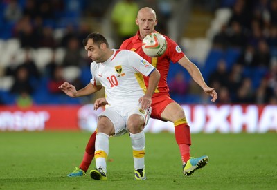 111013 - Wales v Macedonia - FIFA 2014 World Cup Qualifier - Goran Pandev of Macedonia and James Collins of Wales compete