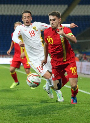 11013 - Wales v Macedonia, World Cup 2014 Qualifying - Wales' Aaron Ramsey gets away from Macedonia's Agim Ibraimi(c) Huw Evans Picture Agency, Cardiff