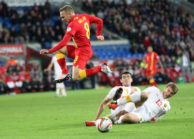11013 - Wales v Macedonia, World Cup 2014 Qualifying - Wales' Craig Bellamy is tackled by Macedonia's Stefan Ristovski(c) Huw Evans Picture Agency, Cardiff