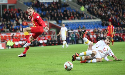 11013 - Wales v Macedonia, World Cup 2014 Qualifying - Wales' Craig Bellamy is tackled by Macedonia's Stefan Ristovski(c) Huw Evans Picture Agency, Cardiff