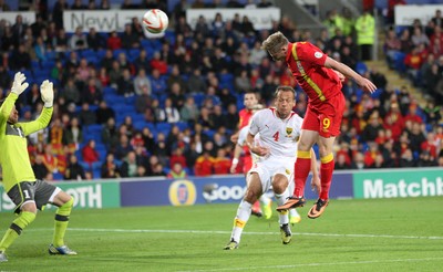 11013 - Wales v Macedonia, World Cup 2014 Qualifying - Wales' Simon Church heads at goal(c) Huw Evans Picture Agency, Cardiff
