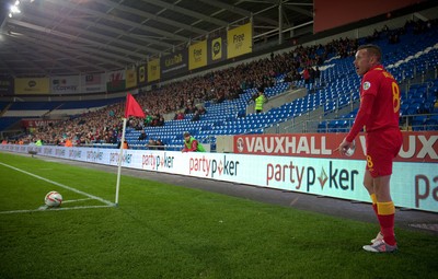 11013 - Wales v Macedonia, World Cup 2014 Qualifying - Wales' Craig Bellamy prepares to take a corner kick in front of a sparse crowd at the Cardiff City Stadium(c) Huw Evans Picture Agency, Cardiff
