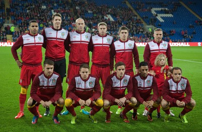 11013 - Wales v Macedonia, World Cup 2014 Qualifying - Wales' Craig Bellamy with his daughter Lexie during the team photograph before the start of his final home match for Wales(c) Huw Evans Picture Agency, Cardiff