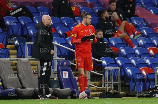 270321 - Wales v Mexico - International Friendly -  Gareth Bale of Wales prepares to take the field with Robert Page