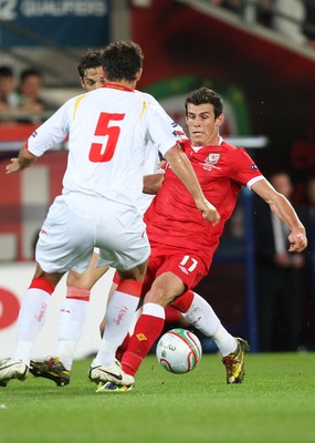 02.09.11 - Wales v Montenegro, Euro 2012 Qualifying -  Wales' Gareth Bale takes on Montenegro's Radoslav Batak 
