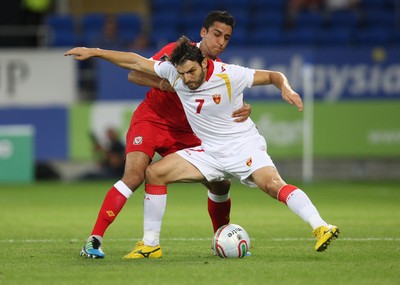 02.09.11 - Wales v Montenegro, Euro 2012 Qualifying -  Wales' Neil Taylor tangles with Montenegro's Simon Vukcevic  