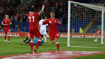 02.09.11 - Wales v Montenegro, Euro 2012 Qualifying -  Wales' Aaron Ramsey celebrates with Gareth Bale after scoring Wales' second goal  
