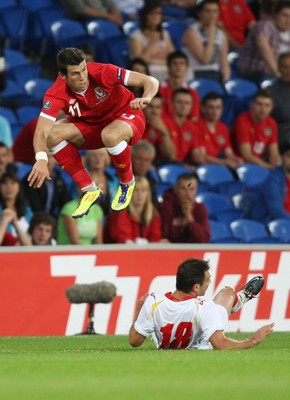 02.09.11 - Wales v Montenegro, Euro 2012 Qualifying -  Wales' Gareth Bale is tackled by Montenegro's Nikola Drincic   