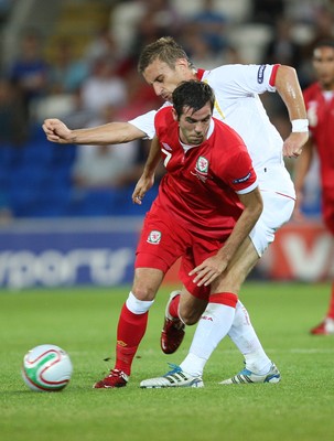 02.09.11 - Wales v Montenegro, Euro 2012 Qualifying -  Wales' Joe Ledley is challenged by Montenegro's Milorad Pekovic      