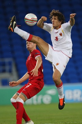 02.09.11 - Wales v Montenegro, Euro 2012 Qualifying -  Montenegro's Stevan Jovetic wins the ball from Wales' Chris Gunter   