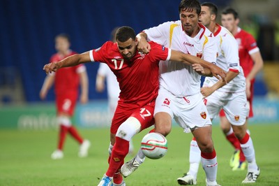 02.09.11 - Wales v Montenegro, Euro 2012 Qualifying -  Wales' Hal Robson-Kanu  and Montenegro's Radoslav Batak compete for the ball  