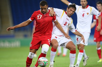 02.09.11 - Wales v Montenegro, Euro 2012 Qualifying -  Wales' Hal Robson-Kanu  and Montenegro's Radoslav Batak compete for the ball  