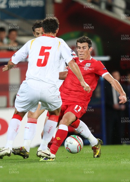 02.09.11 - Wales v Montenegro, Euro 2012 Qualifying -  Wales' Gareth Bale takes on Montenegro's Radoslav Batak 