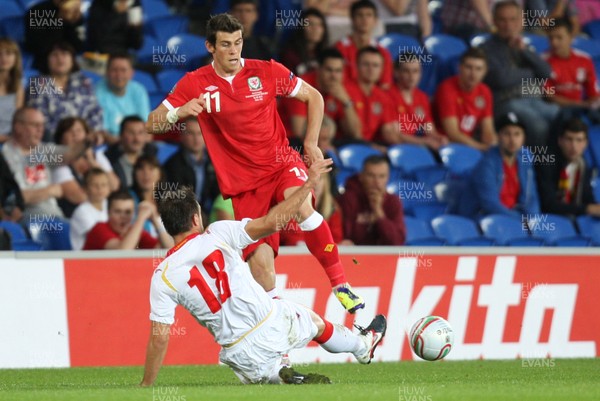 02.09.11 - Wales v Montenegro, Euro 2012 Qualifying -  Wales' Gareth Bale is tackled by Montenegro's Nikola Drincic   