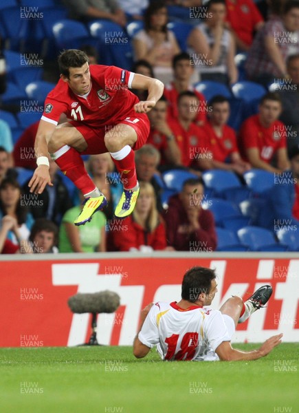 02.09.11 - Wales v Montenegro, Euro 2012 Qualifying -  Wales' Gareth Bale is tackled by Montenegro's Nikola Drincic   