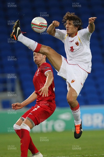 02.09.11 - Wales v Montenegro, Euro 2012 Qualifying -  Montenegro's Stevan Jovetic wins the ball from Wales' Chris Gunter   