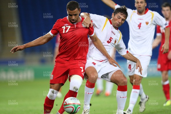 02.09.11 - Wales v Montenegro, Euro 2012 Qualifying -  Wales' Hal Robson-Kanu  and Montenegro's Radoslav Batak compete for the ball  