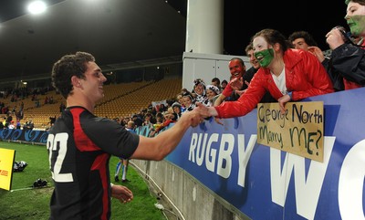 26.09.11 - Wales v Namibia - Rugby World Cup 2011 - George North meets a fan at the end of the game. 